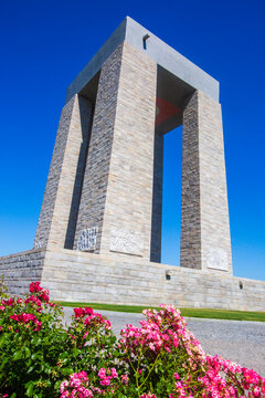 Majestic Canakkale Martyrs Memorial Monument and Pink Roses Under Blue Sky in Gallipoli Turkey