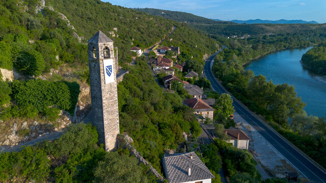 Aerial Drone View of Historic Ottoman Clock Tower and Neretva River in Pocitelj Bosnia