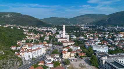 Fototapeta premium Panoramic Aerial Drone View of Mostar Cityscape with Peace Bell Tower in Bosnia and Herzegovina