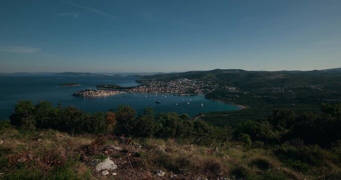 Elevated panoramic view of Primo&scaron;ten coastline with the Adriatic Sea, marina, islands, and surrounding hills in Croatia.