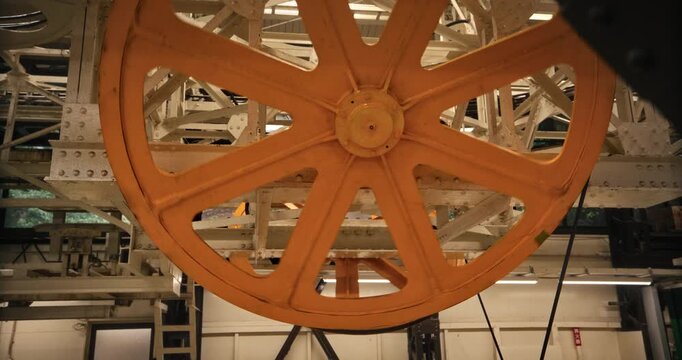 Large, Orange Spoked Pulley Wheel Of Gondola In Hiroshima, Japan