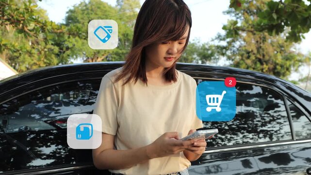  young East Asian woman completes an online purchase using her mobile phone next to her car, with digital shopping carts, sales tags, and payment QR code icons appearing.