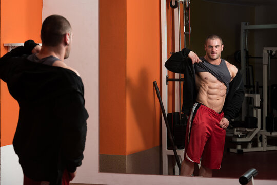 Young Bodybuilder Flexing Muscles