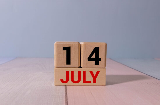 July 14 Date on Wooden Block Calendar Minimal Time Management and Planning Concept