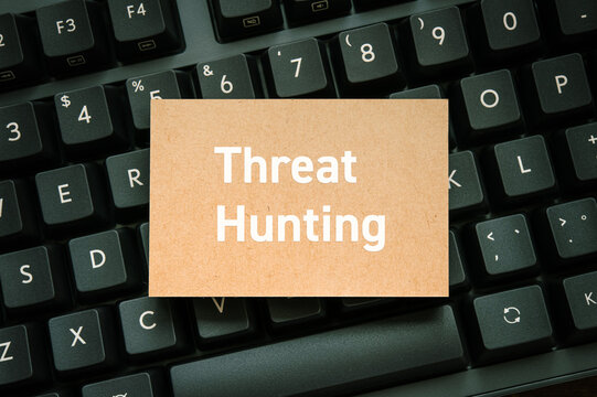 Secure technology and Threat Hunting on card with keyboard. Cyber security, protection and digital trust.