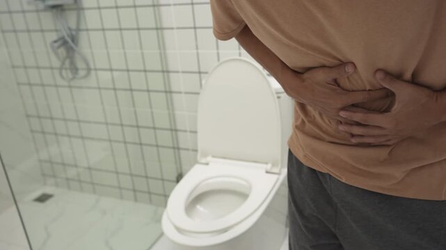 Constipation and diarrhea in bathroom. Hurt man touch belly  stomach ache painful. colon inflammation problem, toxic food, abdominal pain, abdomen, constipated in toilet, stomachache, Hygiene