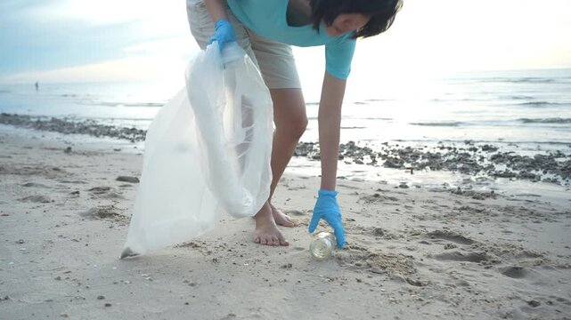 Save ocean. Volunteer pick up trash garbage at the beach and plastic bottles are difficult decompose prevent harm aquatic life. Earth, Environment, Greening planet, reduce global warming, Save world