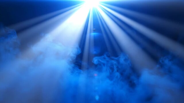 Bright blue spotlight rays through smoke on a dark background