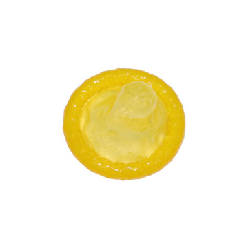 Yellow condom with textured rim laid flat with clear reservoir during studio lighting