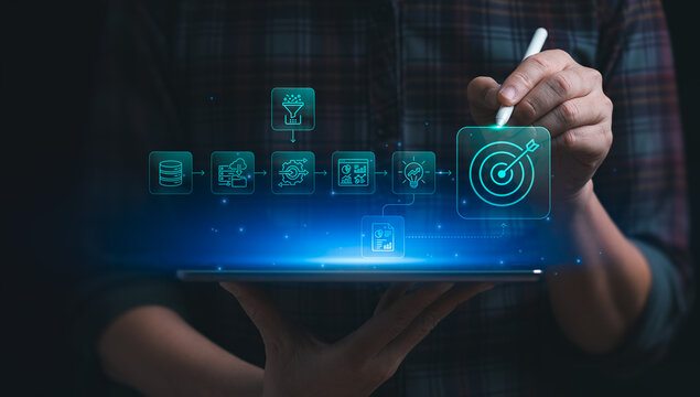 Business strategy workflow concept with person using laptop and virtual target interface showing data process automation analytics idea development and successful goal achievement