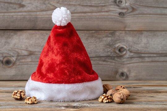 A santa hat sitting on top of a wooden table