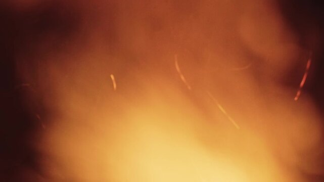 Incandescent bonfire embers rising in the air, creating a captivating spectacle of sparks and smoke against the dark night sky, symbolizing warmth, celebration, and untamed natural energy