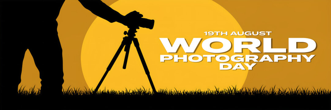 Photographer with tripod and camera against a large sun at sunset