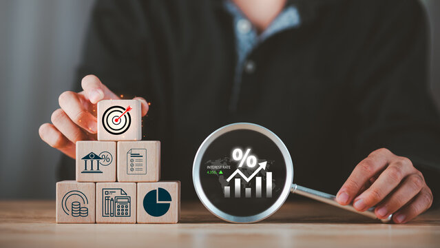 Financial advisor evaluating interest rates and dividend income strategies while optimizing portfolio performance, wealth accumulation, investment planning, passive income generation