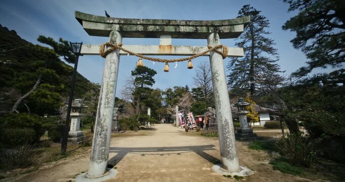Stone Torii Gate at Japanese Shinto Shrine In Hiroshima Japan - Steady Cam Movement