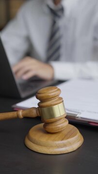 Lawyer typing on laptop doing Legal documents