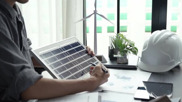 Electrical engineer working with solar panel sustainable energy concept