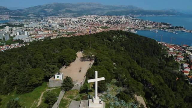 Aerial view of the cross at telegrin peak overlooking split croatia