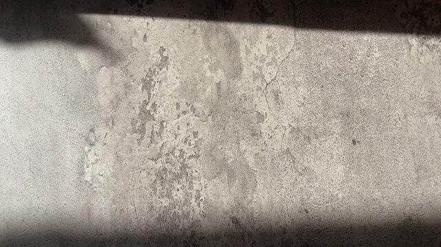 Texture concrete wall of light grey color cement texture background.Grey pastel rough crack cement texture stone concrete,rock plastered stucco wall; painted flat fade background. Side view. close up.