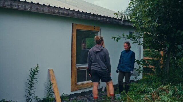 Timelapse Of Man Repairing Window Frame Outdoors