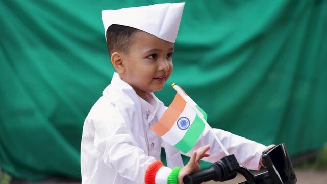 republic day inspired portrait of young boy with indian national flag in traditional dress