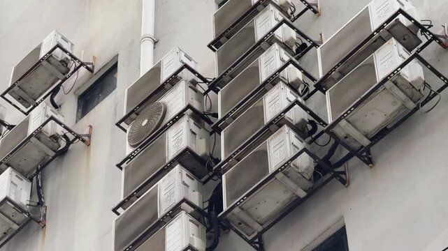 Multiple Air Conditioning Units Mounted on Urban Building Wall