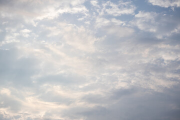 Fototapeta premium Beautiful blue sky background with scattered white clouds on a sunny day