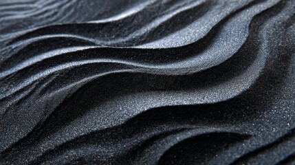 Fototapeta premium Black sand beach macro texture background with natural ocean wave patterns, dark volcanic sand surface, abstract coastal landscape detail, luxury nature backdrop, organic beach texture for design and 