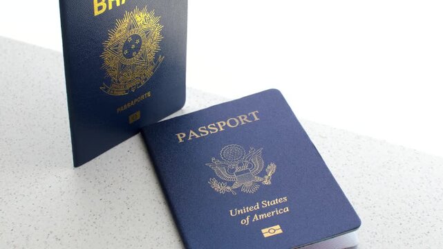 Brazilian passport alongside the American passport: symbols of global connection and international travel.