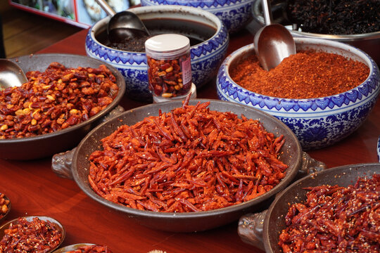 A taste of Guizhou. Bold and spicy local chili dishes at the historic Qingyan Ancient Town market, China.