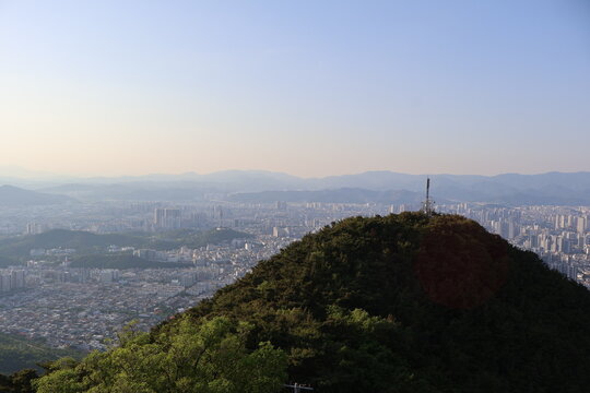 A sunset cityscape view of Daegu, South Korea, seen from Apsan Mountain