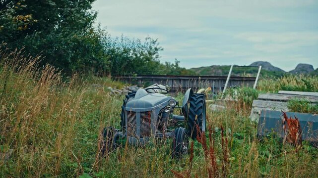 Old Abandoned Ferguson Tractor On The Farm Field
