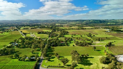 Fototapeta premium McLaren Vale, South Australia – 4K aerial drone view of residential estates, modern homes, suburban streets, established neighbourhoods, tree-lined avenues and scenic wine country landscapes.