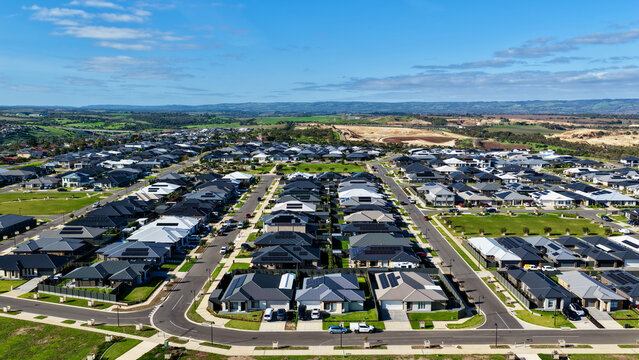 Moana, South Australia &ndash; 4K aerial drone view of coastal cliffs, sandy beach, turquoise ocean, suburban homes, modern housing estates, scenic coastline and seaside landscapes in South Adelaide