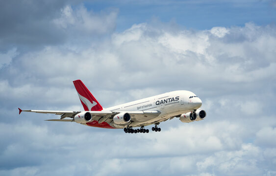 Qantas Airways aircraft, Airbus A380-800, Fergus McMaster, airborne over Dallas Fort Worth International Airport (DFW). Storm clouds.
