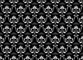Fototapeta premium Wallpaper in the style of Baroque. White and black floral ornament. Seamless vector background. Graphic pattern for fabric, wallpaper, packaging. Ornate Damask flower illustration.