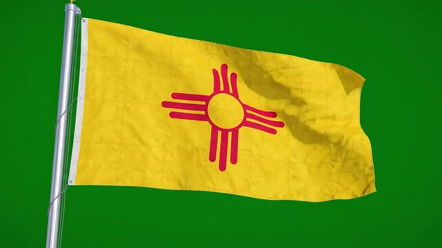 Flag of new mexico, a state in the southwestern united states, waving on a flagpole against a green background