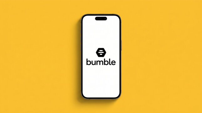 Bumble dating and networking app logo on the smartphone iPhone 14 Pro screen. Minimalist layout on a solid yellow background. Mobile application interface for social discovery and online dating.