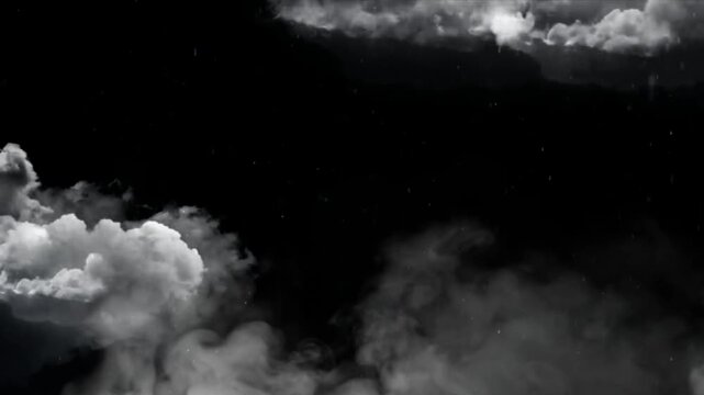 Clouds drift across a dark night sky creating an atmospheric backdrop for various creative design projects and digital artistic compositions.