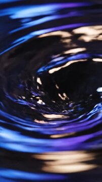 Water drop impact creating splash and ripples on surface
