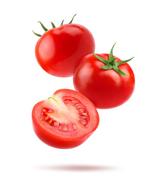Tomato with halve isolated on white.