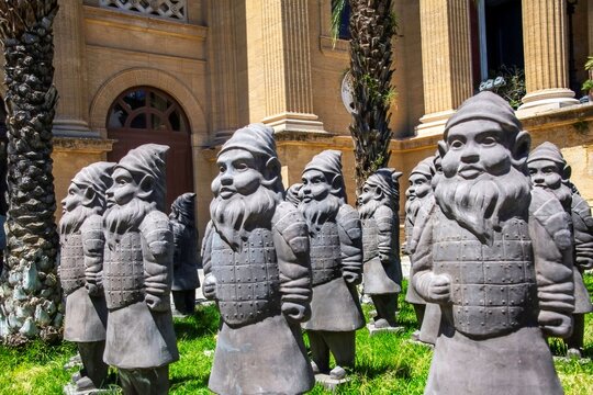 Palermo, Italy 05 12 2026: group of stone dwarves as part of an art installation titled "Extinction"by artist Max Papeschi outside the Grand Theater in Palermo
