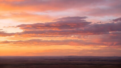 Fototapeta premium Vibrant Sunset Sky with Hues of Orange Pink and Purple