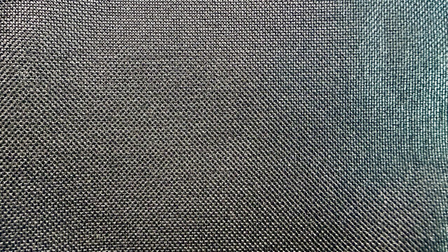 dark charcoal gray nylon fabric texture macro shot of durable synthetic mesh material