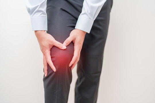 man having knee ache and muscle pain due to Runners Knee or Patellofemoral Pain Syndrome, osteoarthritis, arthritis, rheumatism and Patellar Tendinitis. medical concept