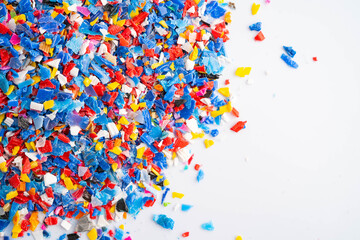 Plastic colorful pieces recycling shredded for industrial use. © Warawan