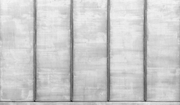 Metal roof painted in white, top view. Black and white rustic texture ideal as a background