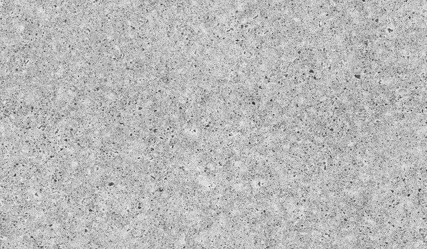 A speckled concrete ground with tiny pebbles and granular texture. Seamless black and white background photo