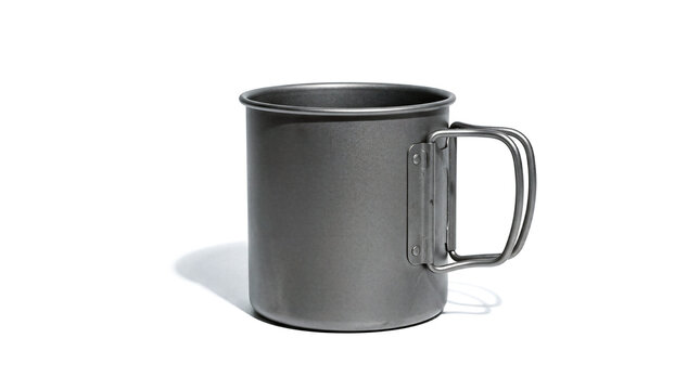 Modern grey titanium metal camping mug featuring folding handles isolated over clean white background displaying durable professional outdoor hiking equipment gear