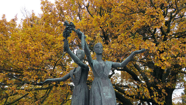 Bratislava, Slovakia. Two statues of young women with flowers in their hands at Slavin War Memorial Monument.